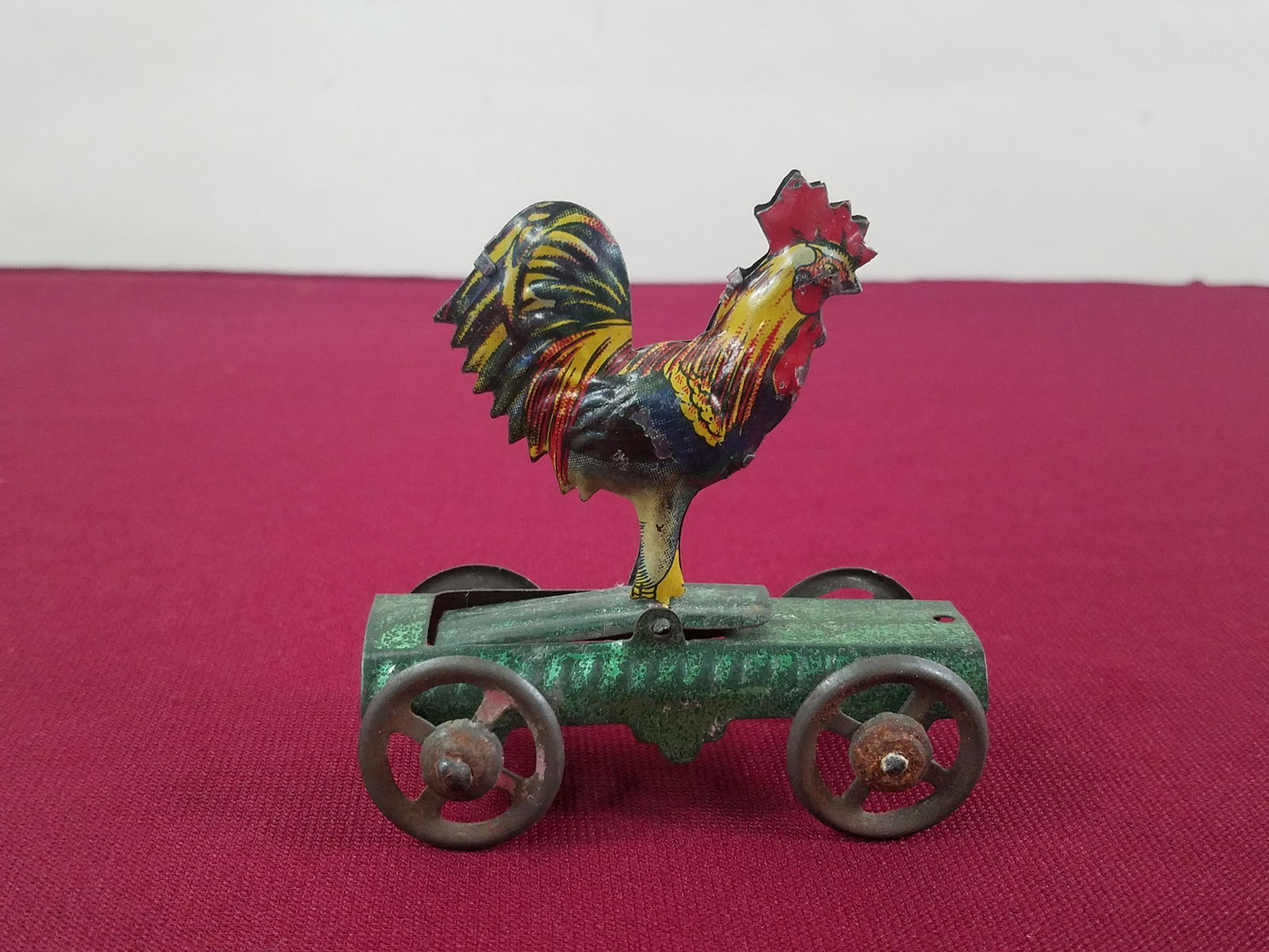 Pecking Rooster Penny Toy: 3" long x 3-1/4" high. IMPORTANT: Before bidding, please read the terms and conditions below. When you registered for the auction you agreed to these terms and will be required to comply with them.