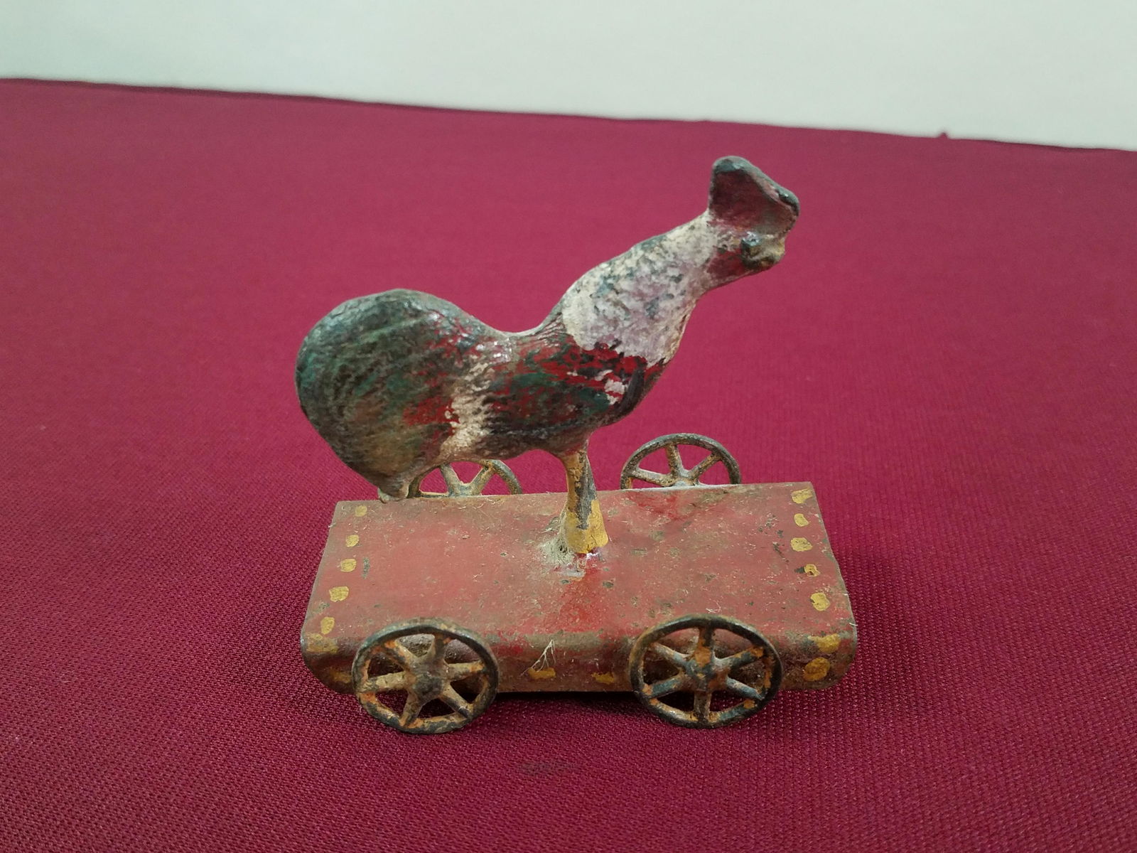 Rooster Penny Toy: 3-1/4" long x 3" high. IMPORTANT: Before bidding, please read the terms and conditions below. When you registered for the auction you agreed to these terms and will be required to comply with them.
