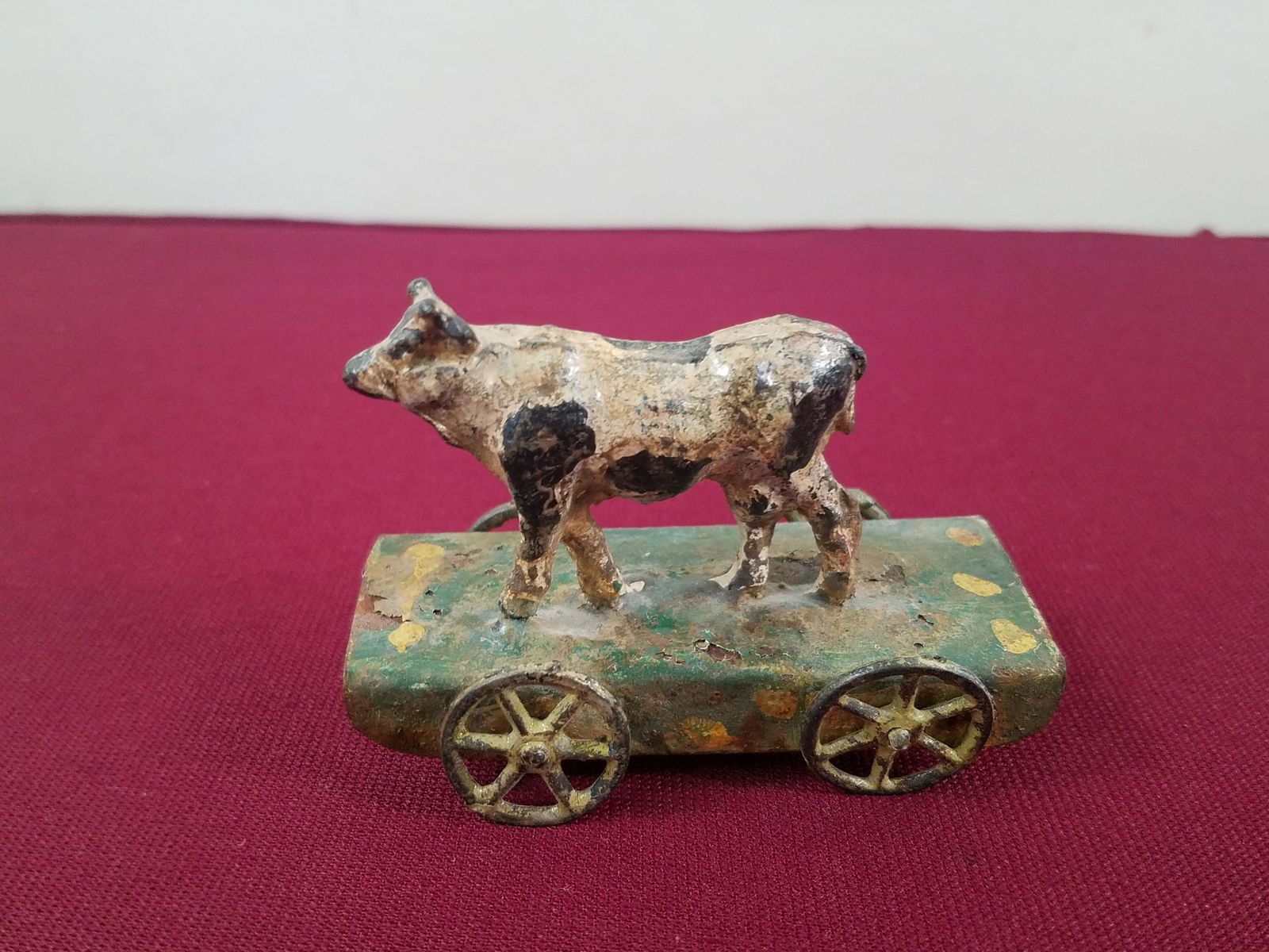 Cow Penny Toy: 3" long x 2-1/2" high. IMPORTANT: Before bidding, please read the terms and conditions below. When you registered for the auction you agreed to these terms and will be required to comply with them.