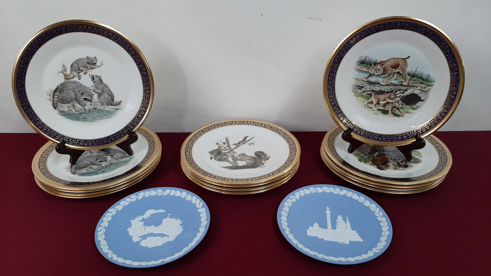 14 Lenox and 2 Wedgwood Plates: Includes Lenox Woodland Wildlife and Wedgwood Christmas 1969 & 1970 with original box. IMPORTANT: Before bidding, please read the terms and conditions below. When you registered for the auction you ag