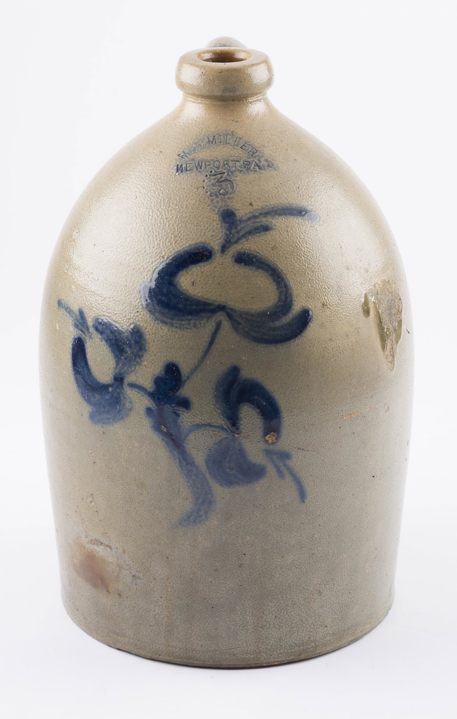 M&T Miller Newport PA Stoneware Jug: DESCRIPTION: 3 Gallon Jug with cobalt floral design. Stamped "M. & T. Miller Newport PA" with capacity mark. MEASUREMENTS: 9-1/2" diameter x 16" high. CONDITION: Firing imperfections, as made.