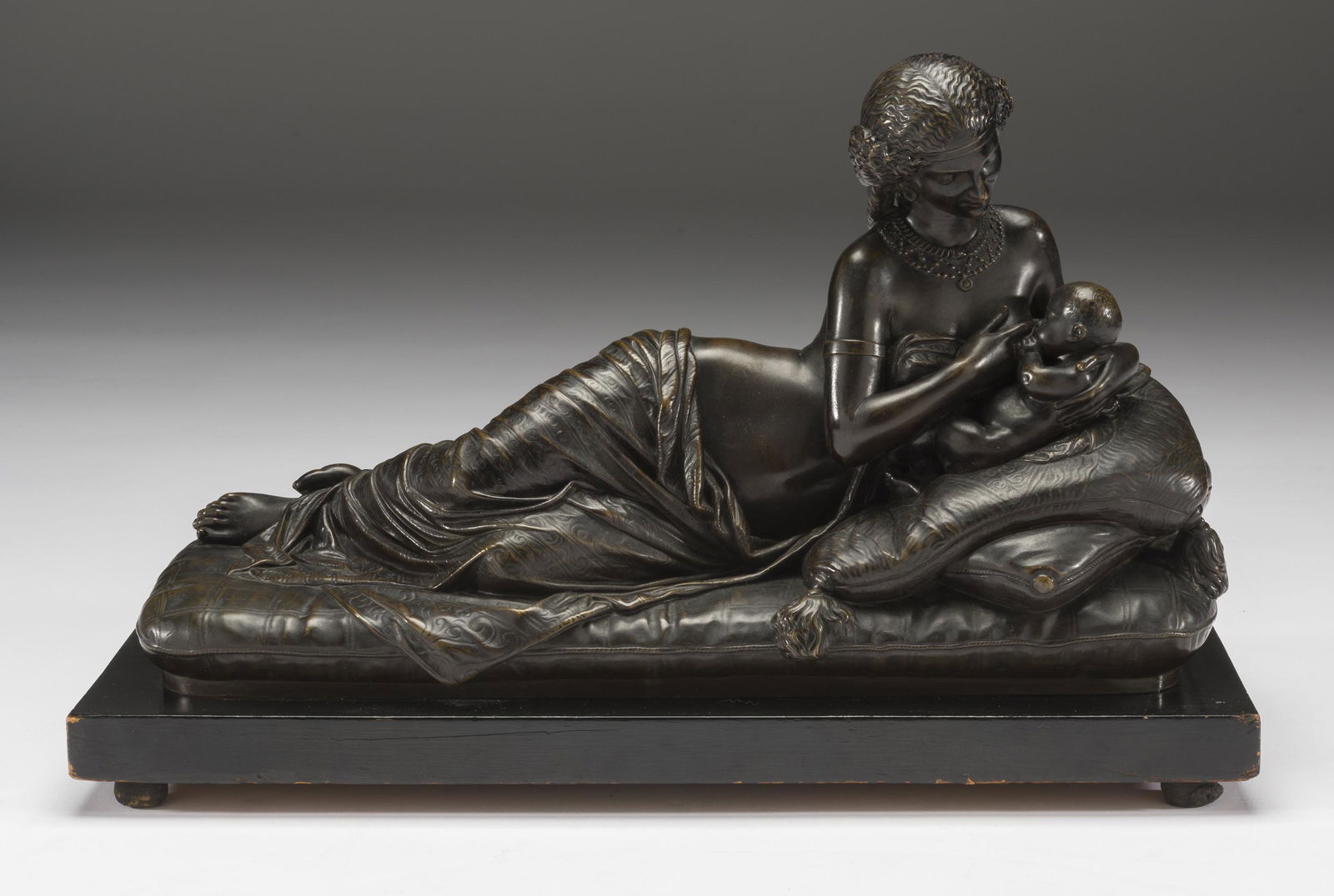 After Francois Protheau (France, 1823-1965) Bronze: DESCRIPTION: After Francois Protheau (France, 1823-1965). Cast bronze. Nourice Indienne. Footed wooden base. Signed "PROTHEAU 1857." Written to bottom: "Victor Paillard / Fabricant de Bronzes a Paris