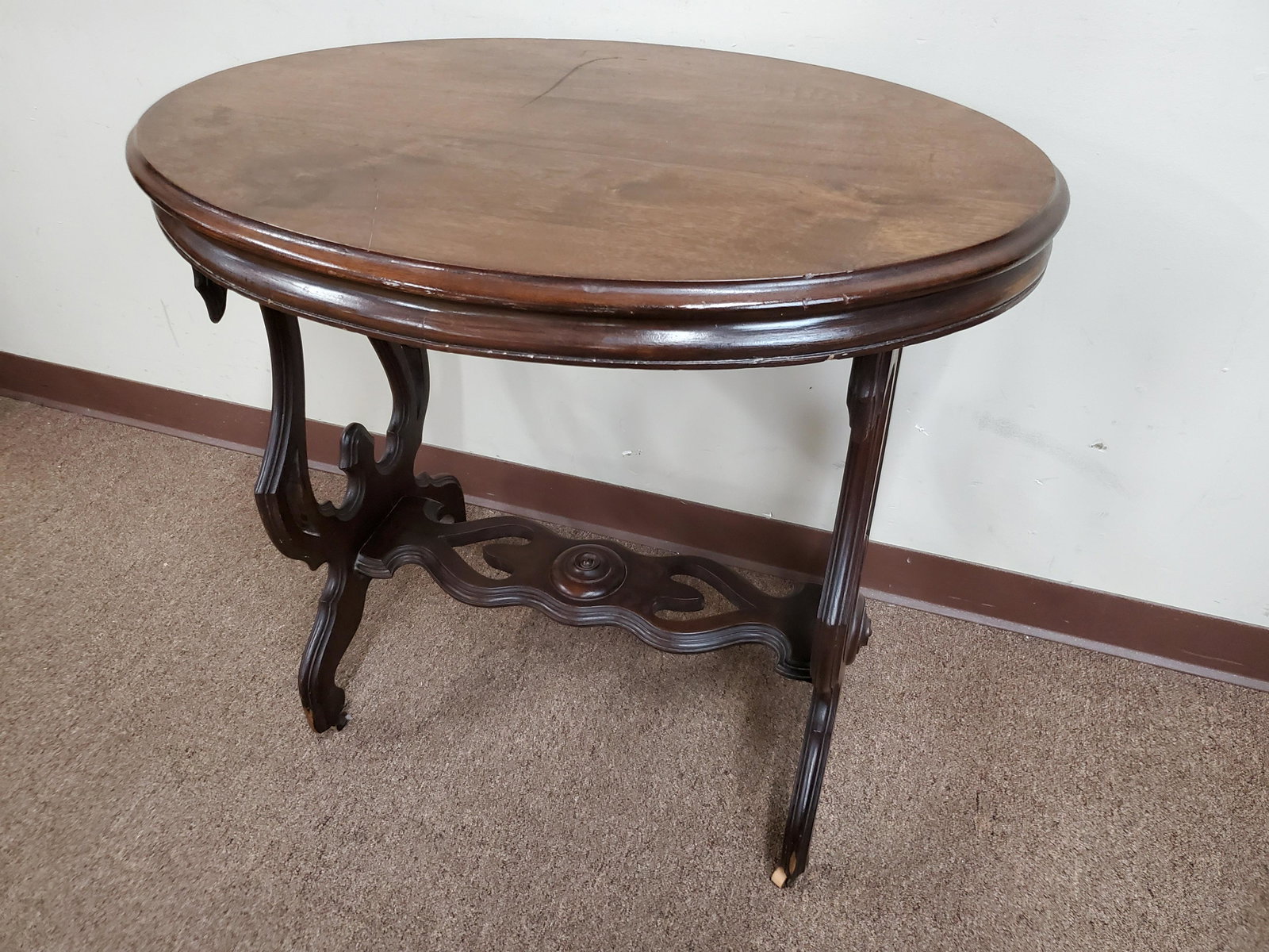 Oval Side Table: 32" wide X 20 1/4" deep X 28 3/4" high. Split to wood on side. IMPORTANT: Before bidding, please read the terms and conditions below. When you registered for the auction you agreed to these terms and 
