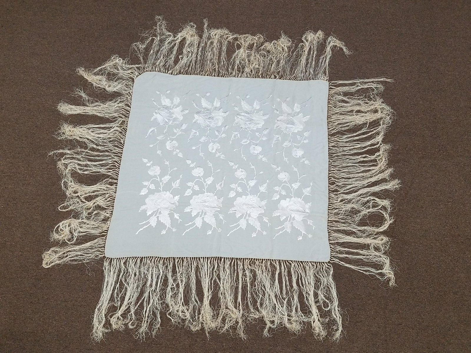 Floral Piano Scarf / Shawl: 49" long x 46-1/2" wide. Some discoloration. IMPORTANT: Before bidding, please read the terms and conditions below. When you registered for the auction you agreed to these terms and will be required t