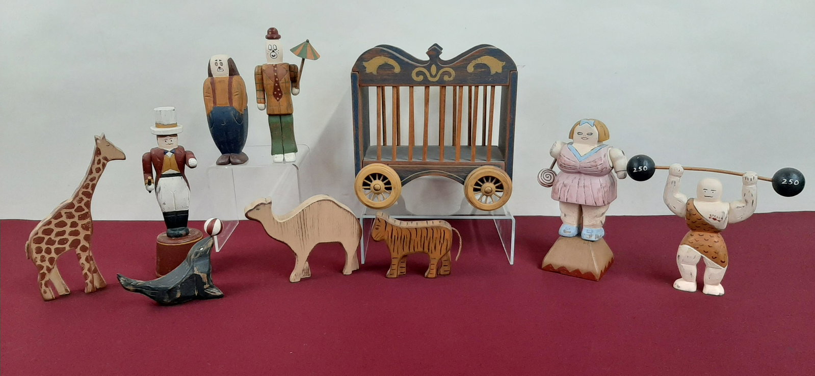 10 Pc Wolf Creek Circus Wagon with Figures: Wagon: 10" wide X 6 1/2" deep X 10" high. Figures: 4 1/4" to 9" high. IMPORTANT: Before bidding, please read the terms and conditions below. When you registered for the auction you agreed to these ter
