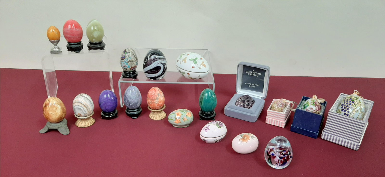 20 Pc Egg Collection: Includes Hardstone, Waterford, Wedgwood, and enameled. 1 1/2" to 3" high. IMPORTANT: Before bidding, please read the terms and conditions below. When you registered for the auction you agreed to these