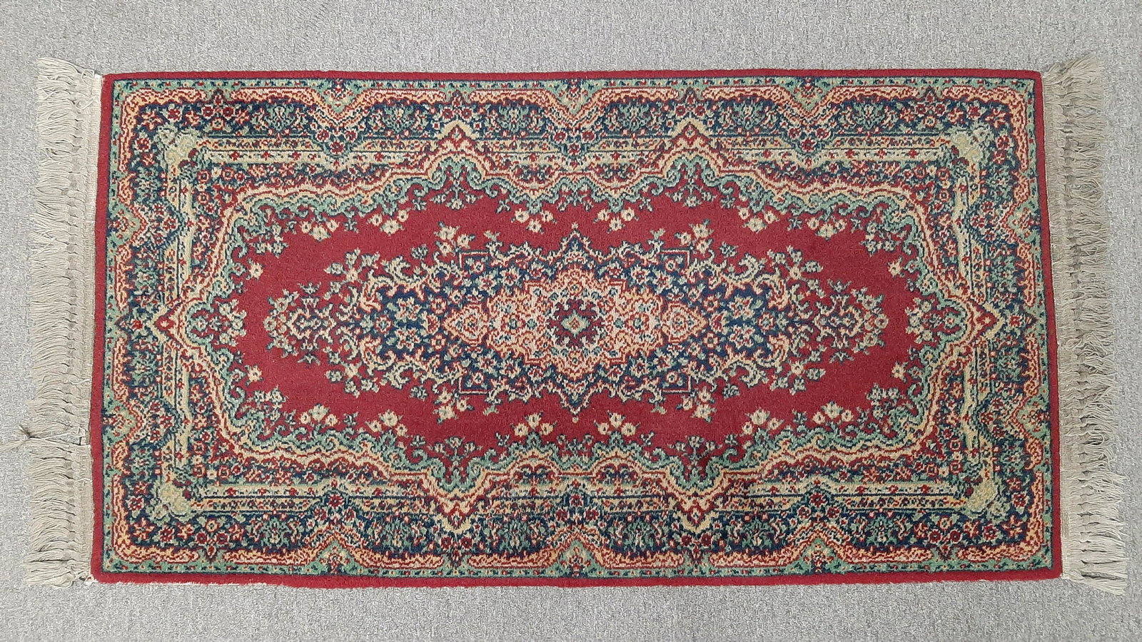 Wool Area Rug: Machine made. 4' 10" long X 2' 4" wide. IMPORTANT: Before bidding, please read the terms and conditions below. When you registered for the auction you agreed to these terms and will be required to com