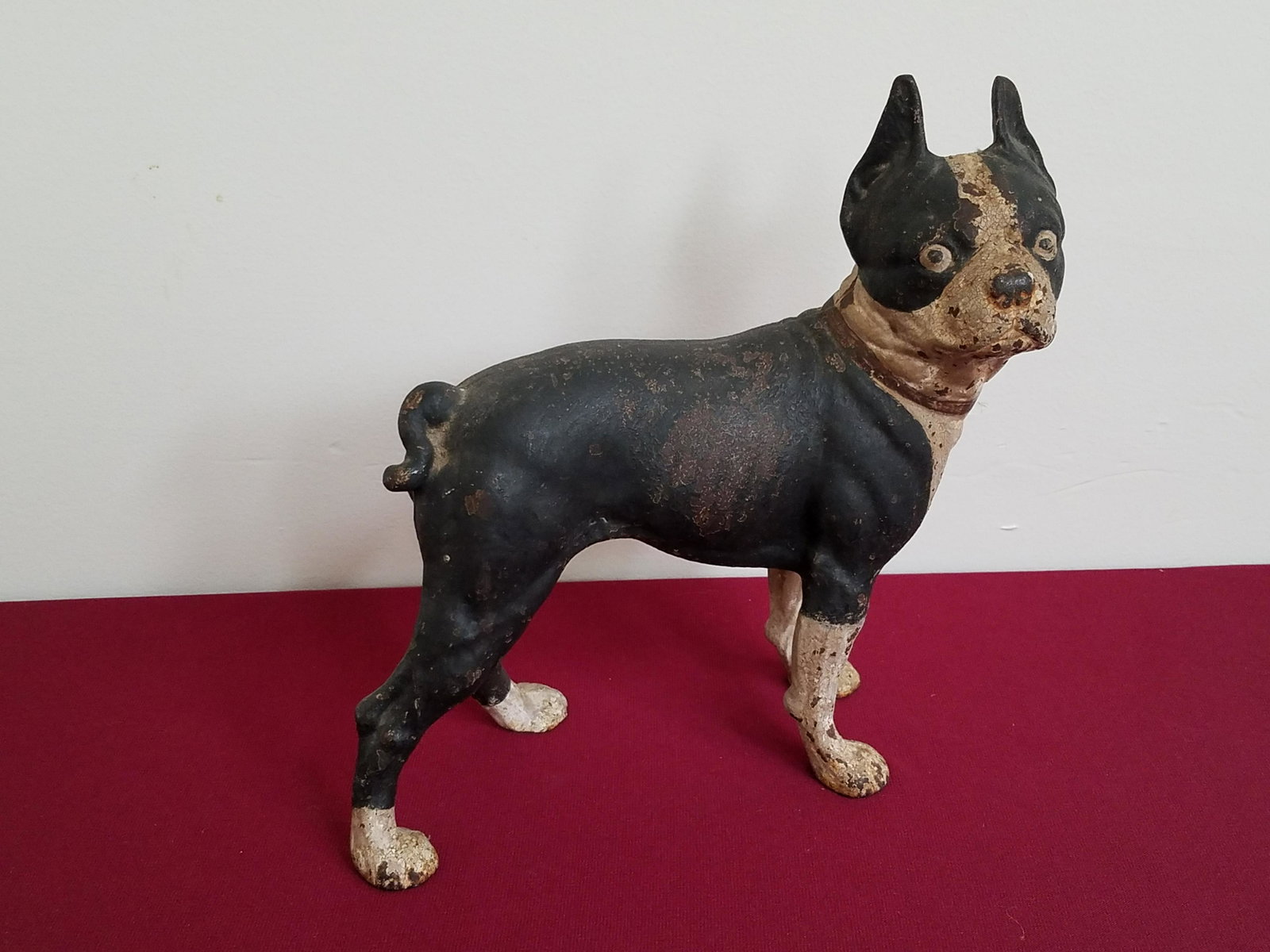 Cast Iron Dog Door Stop: 10" wide x 5" deep x 10-1/2" high. Some paint losses. IMPORTANT: Before bidding, please read the terms and conditions below. When you registered for the auction you agreed to these terms and will be r