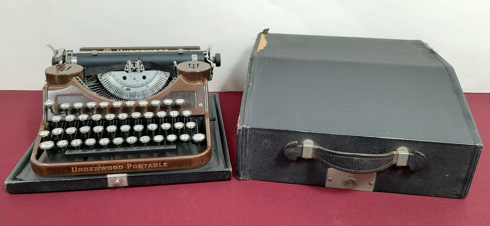 Underwood Portabe Typewriter with Case: 12 1/2" wide X 12 1/2" deep X 5 1/2" high. IMPORTANT: Before bidding, please read the terms and conditions below. When you registered for the auction you agreed to these terms and will be required to 