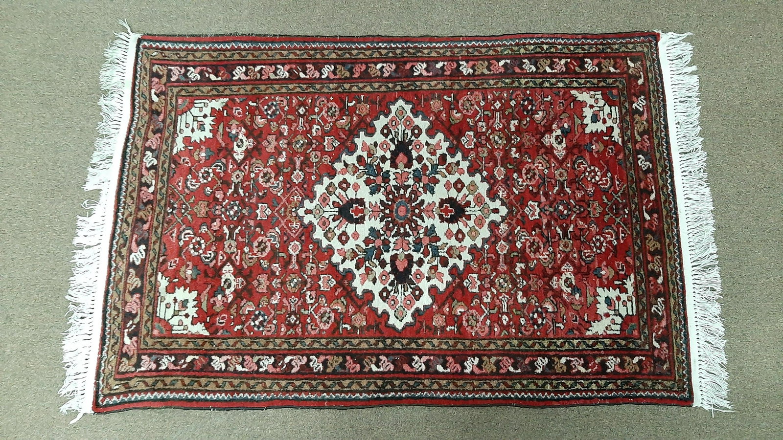 Persian Hamedan Area Rug: Mid 20th century. 3' 5" wide X 5' 4" long IMPORTANT: Before bidding, please read the terms and conditions below. When you registered for the auction you agreed to these terms and will be required to c