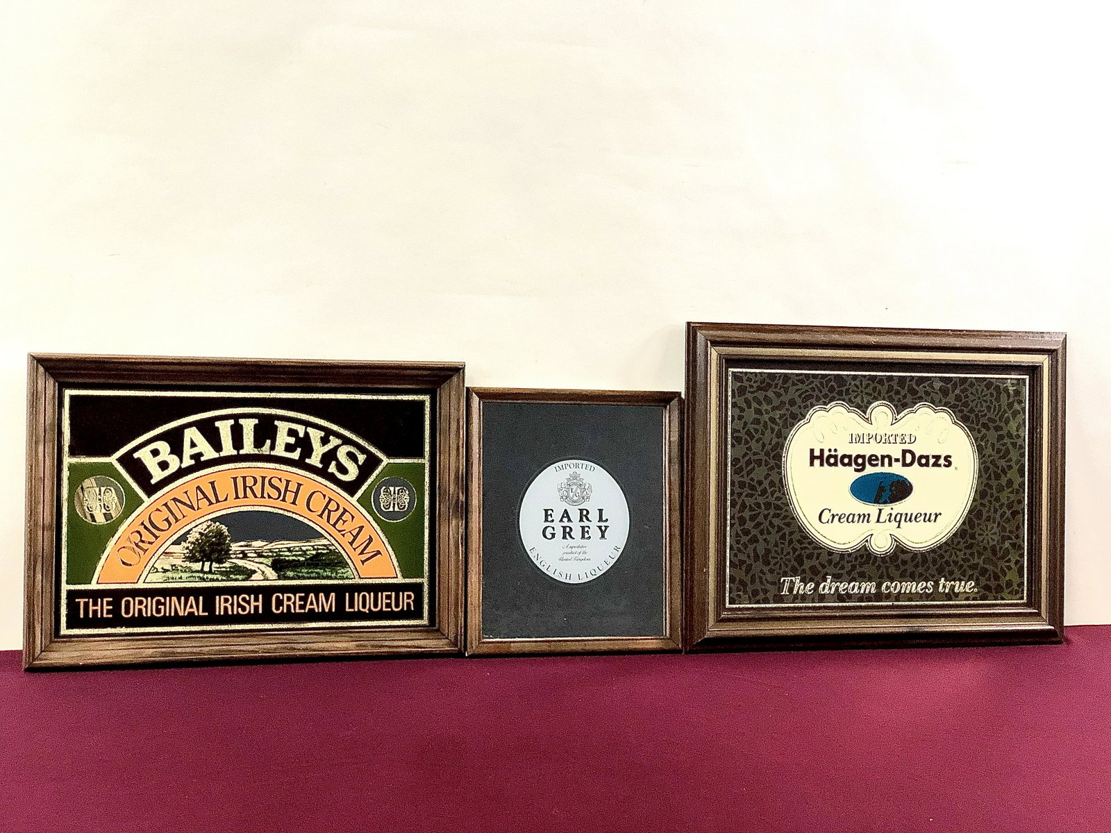5 Dessert Liquor Advertising Mirrors: Includes Bailey's, Häagen-Dazs and Earl Grey. 13" to 21 1/2" high, 11" to 17" wide. IMPORTANT: Before bidding, please read the terms and conditions below. When you registered for the auction you agre