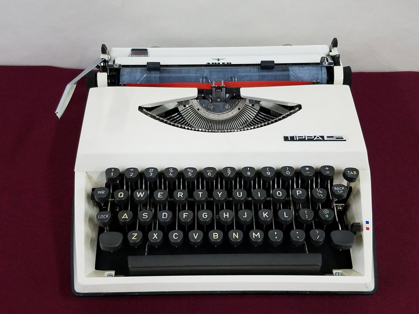 Alder Tippas Typewriter: 12-1/4" wide x 12-1/2" deep x 3-3/4" high. IMPORTANT: Before bidding, please read the terms and conditions below. When you registered for the auction you agreed to these terms and will be required to 