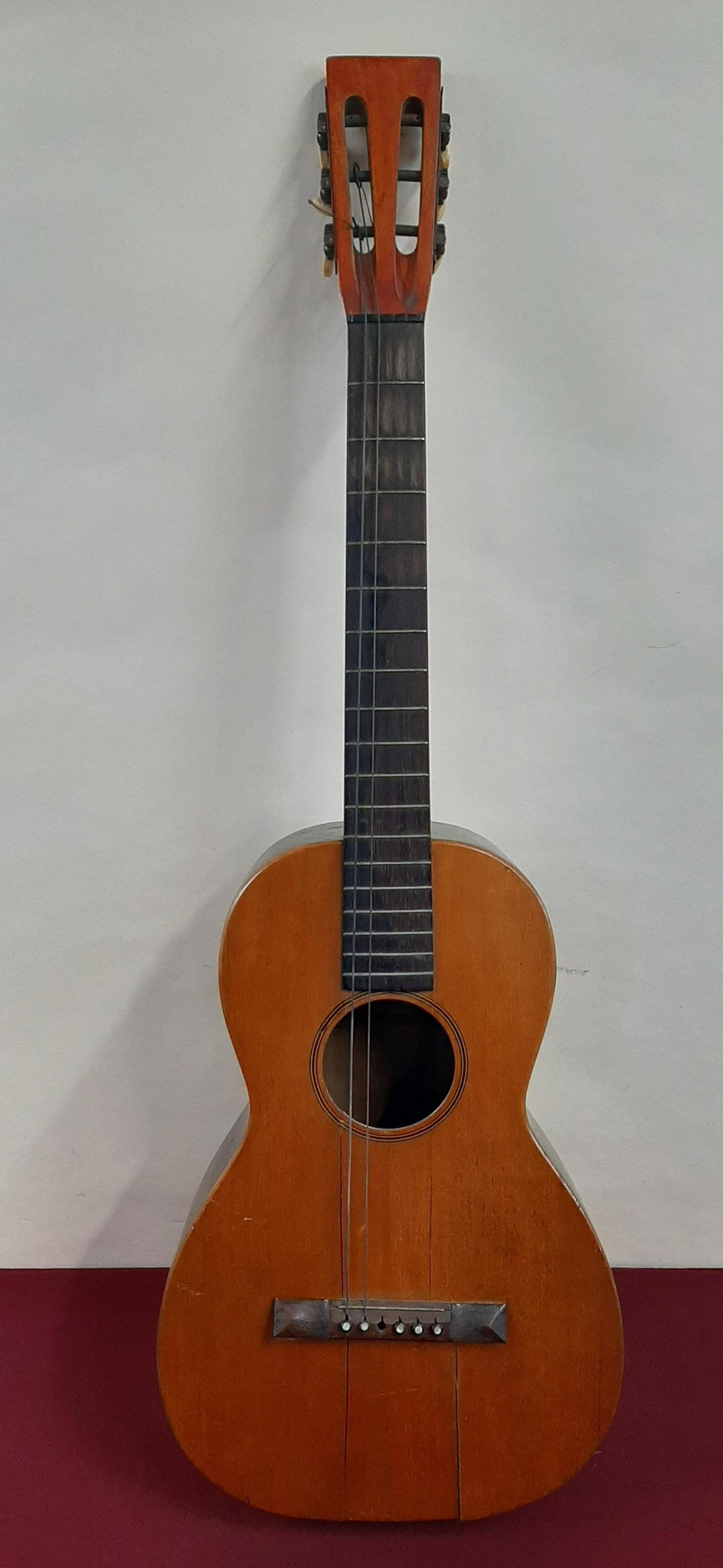 Bay State Acoustic Guitar: 12" wide X 37 1/2" high. Cracks to front and back. Damage to bridge. Some losses. IMPORTANT: Before bidding, please read the terms and conditions below. When you registered for the auction you agreed 