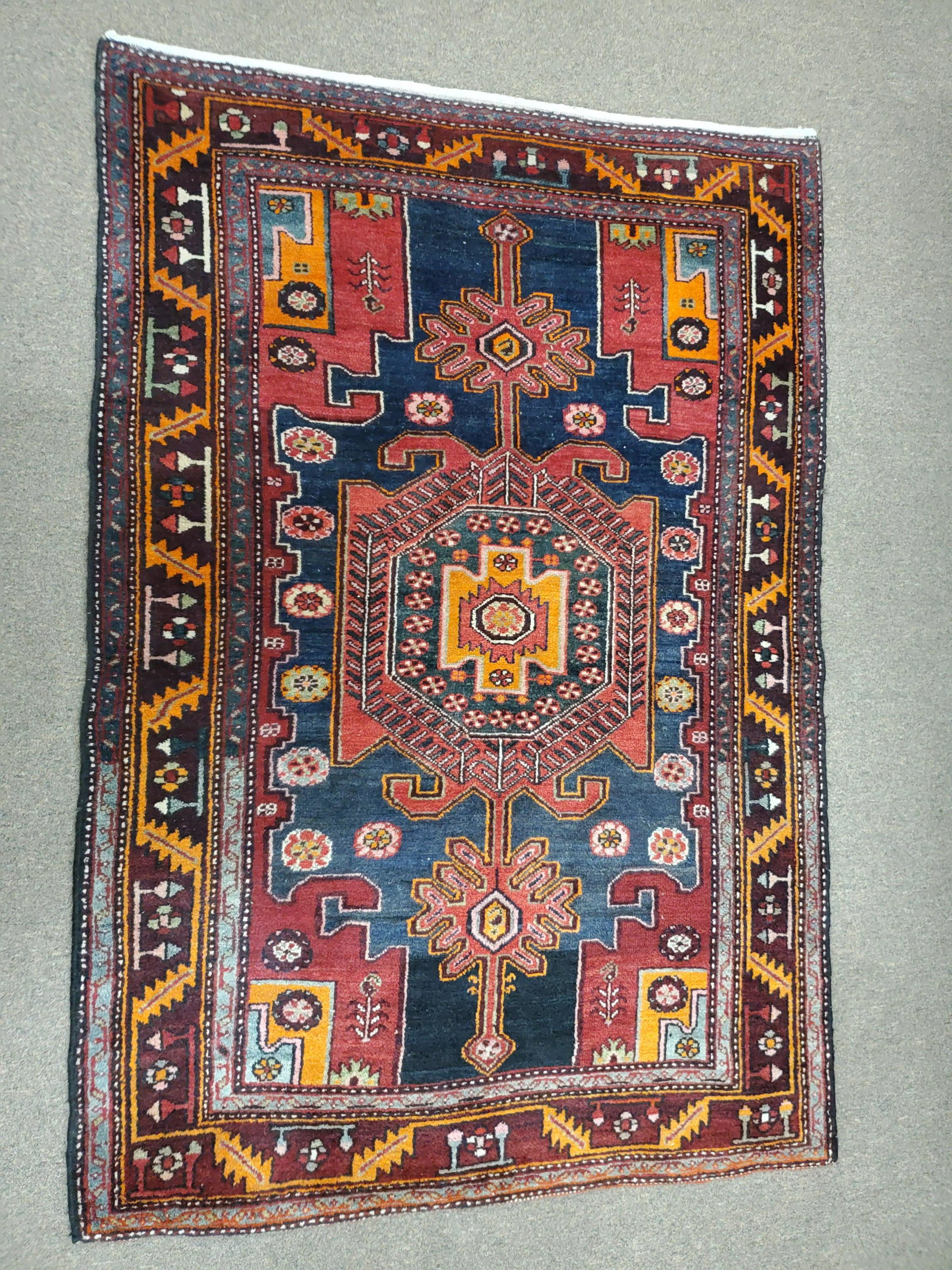 Persian Area Rug: 4'6" wide X 6'4" long. IMPORTANT: Before bidding, please read the terms and conditions below. When you registered for the auction you agreed to these terms and will be required to comply with them.