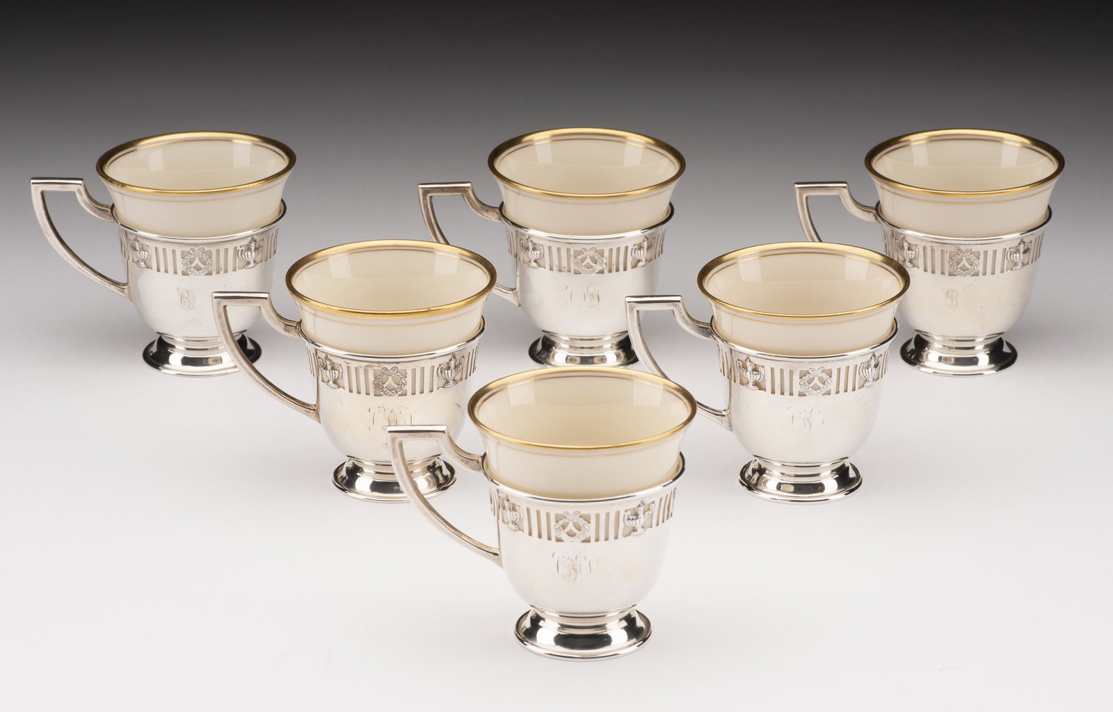 Set of 6 Demitasse Cups with Lenox Liners: 2" diameter x 2-1/2" high. Sterling weight (without liners) 4.3 ozt. Demitasse cups monogrammed. IMPORTANT: Before bidding, please read the terms and conditions below. When you registered for the auct