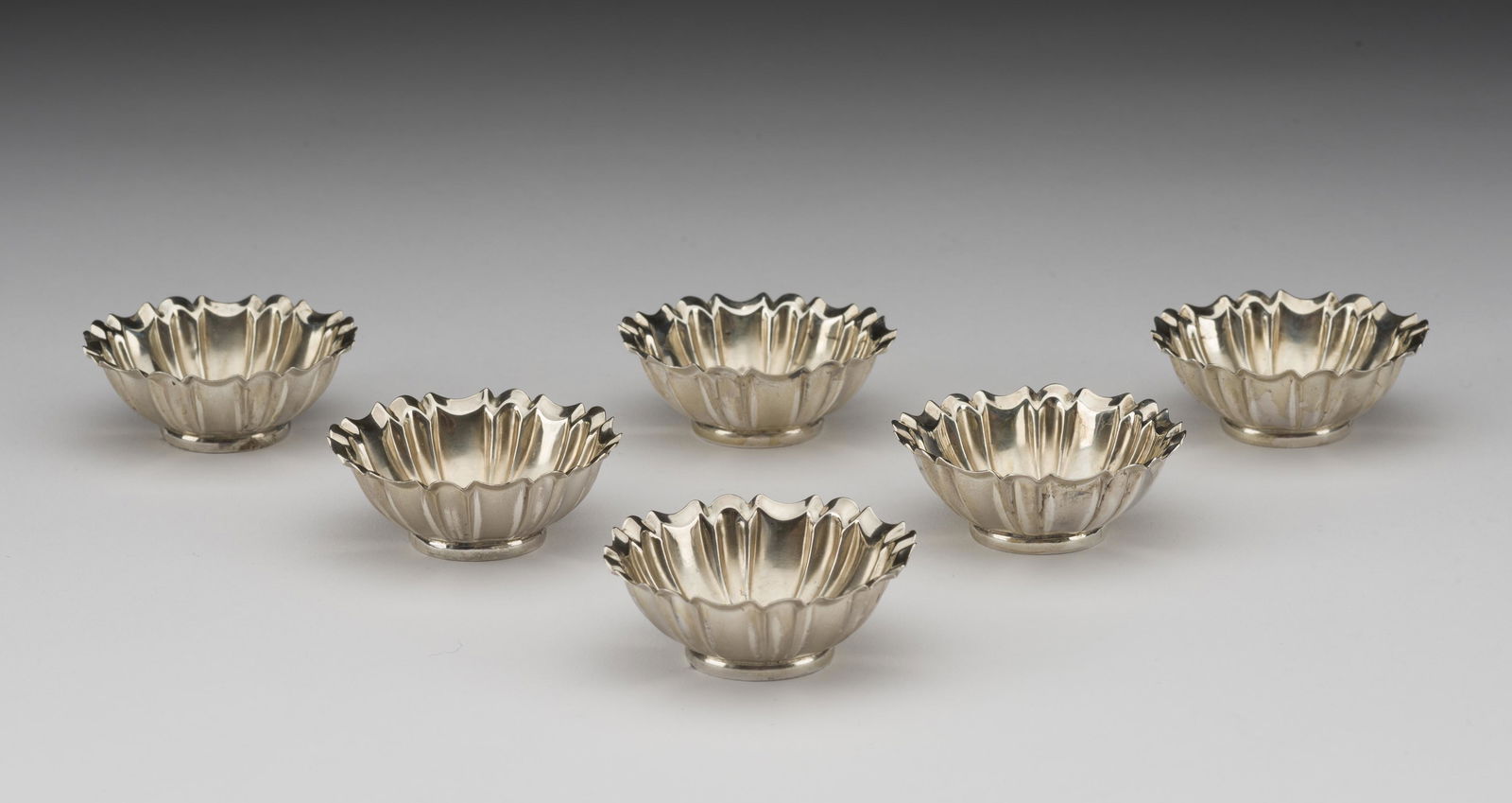 Set of 6 Sterling Open Salts: No maker's mark. 2" diameter. 2.2 ozt. total. IMPORTANT: Before bidding, please read the terms and conditions below. When you registered for the auction you agreed to these terms and will be required