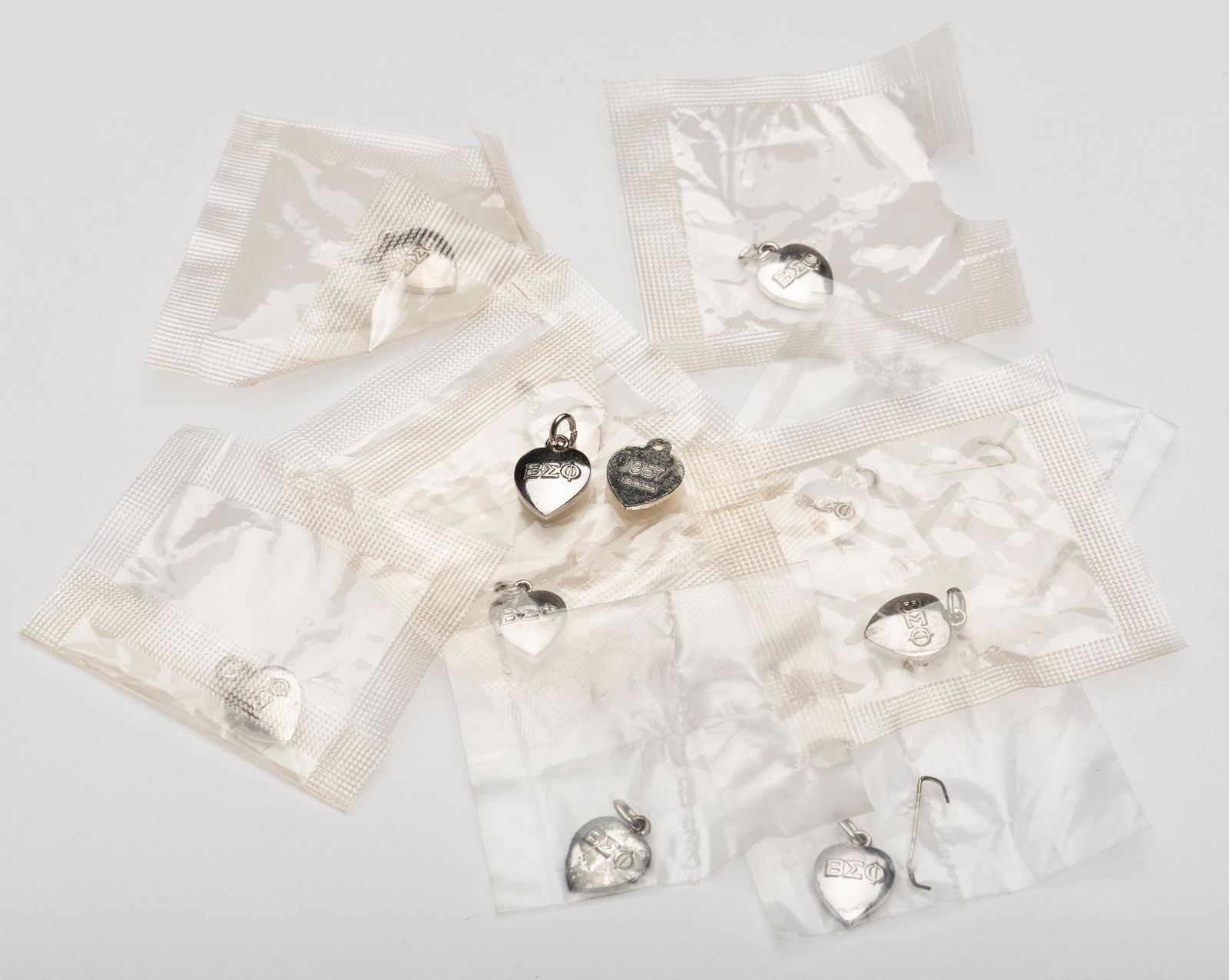 11 Beta Sigma Phi BEO Charms w/ Dates: Dates range from 1957 to 1971. IMPORTANT: Before bidding, please read the terms and conditions below. When you registered for the auction you agreed to these terms and will be required to comply with
