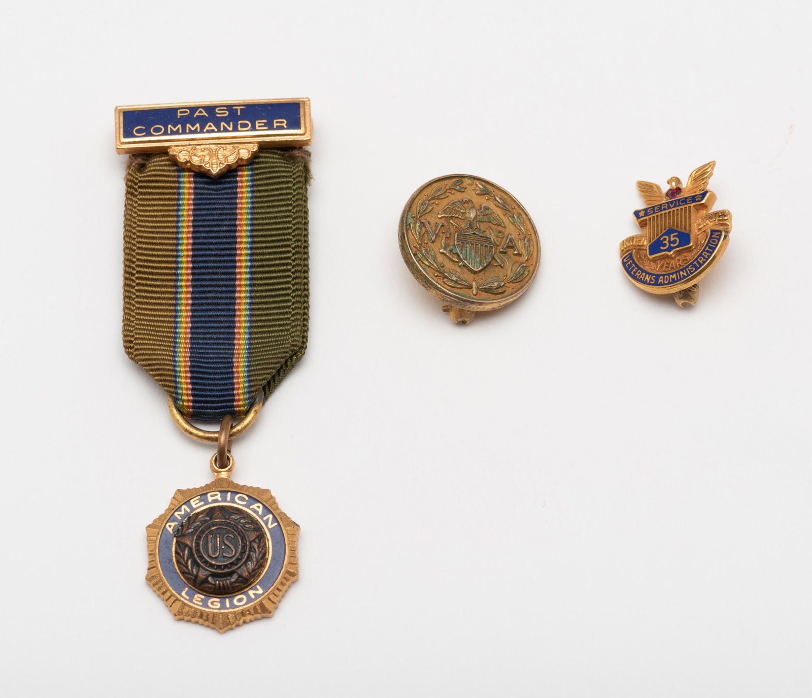 American Legion Medal & 2 10k Pins: Past Commander American Legion medal, 2-1/4". Two 10k Veteran pins, 3.3 dwt. 1/2" and 5/8". IMPORTANT: Before bidding, please read the terms and conditions below. When you registered for the auction y