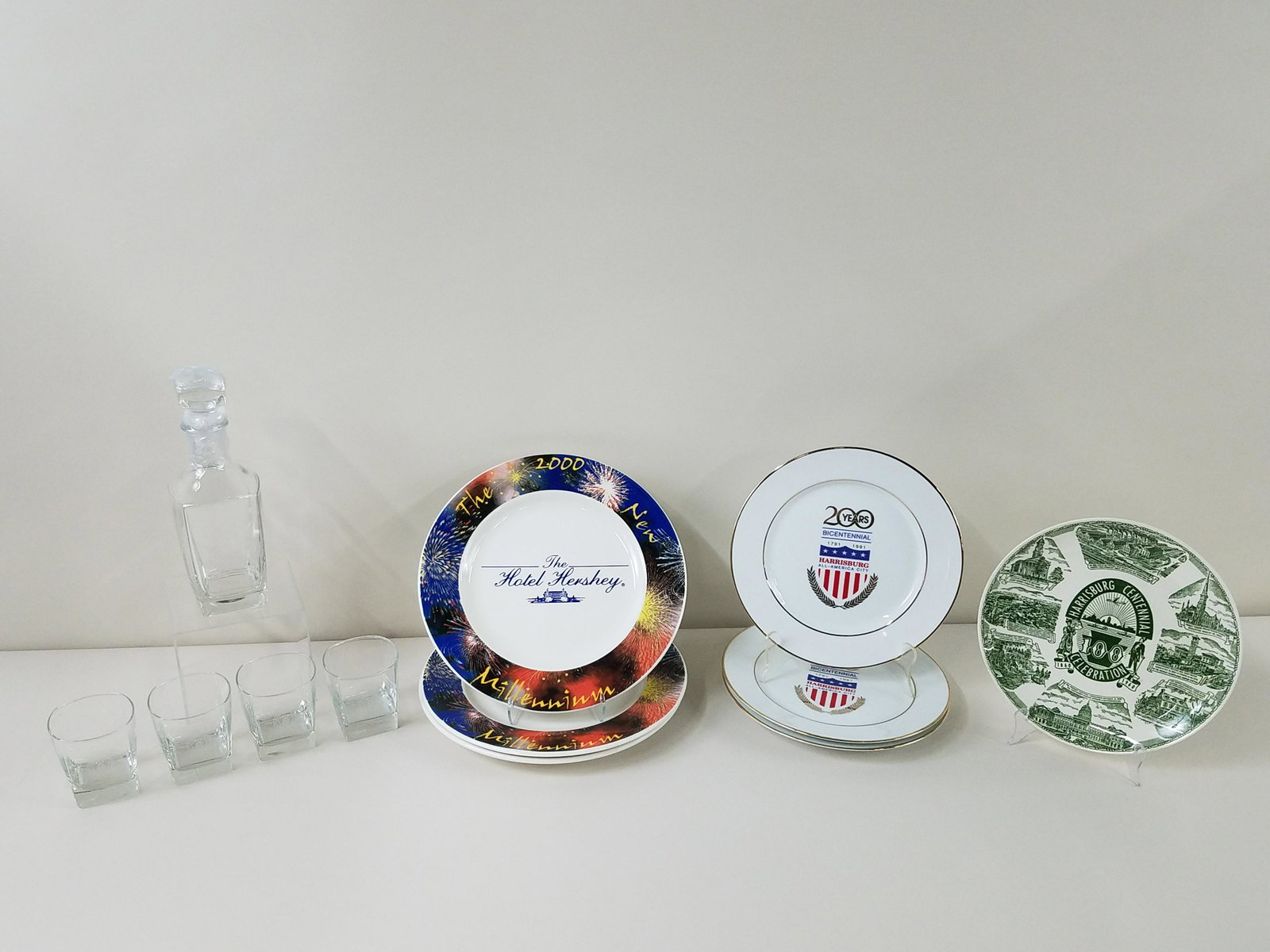 12 Pcs Harrisburg and Hershey Commemoratives: Plates: 10" to 12-1/4" diameter. Decanter set: 3-1/2" to 10-1/2" high.