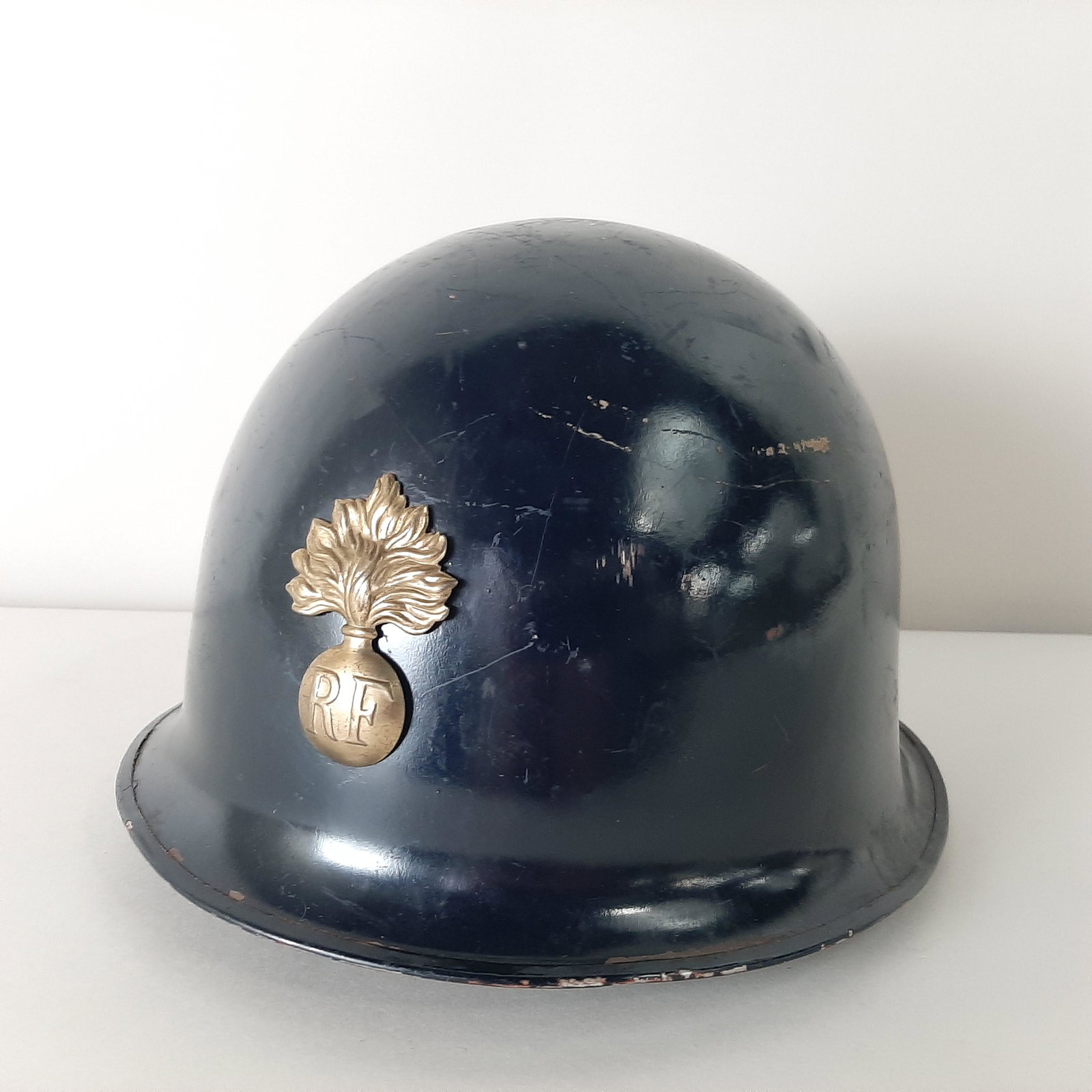 French Foreign Legion Helmet with Emblem & Liner: 9 3/4" wide X 11" deep X 7" high.