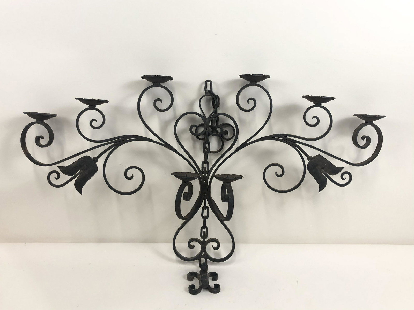 Wrought Iron Wall Candelabra: 35" wide x 1" deep x 18-1/2" high.