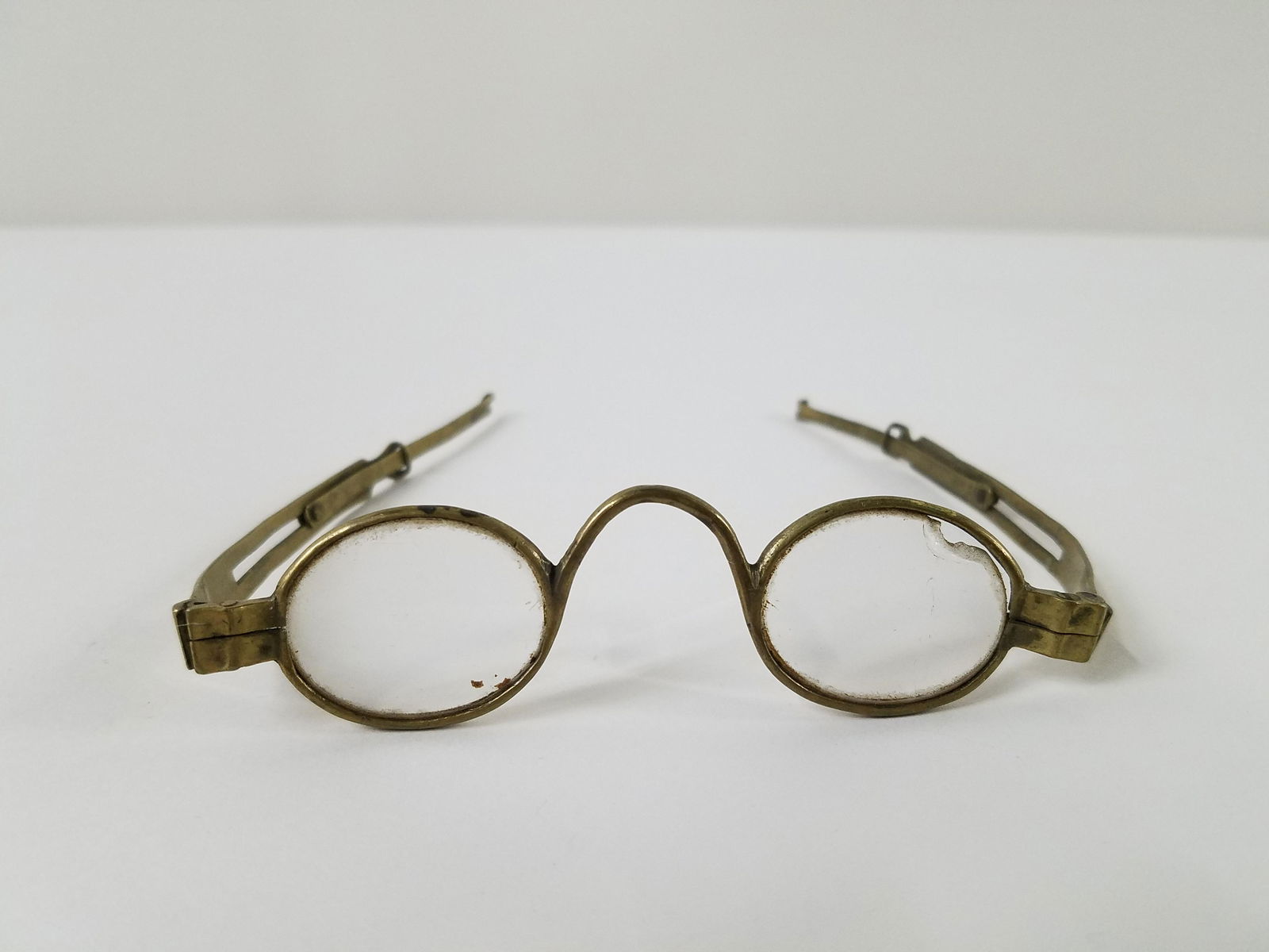 I. R. Rupp Brass Framed Eyeglasses: 5" wide. Extendable length. Loss to one lens. PROVENANCE: These items were purchased from Elizabeth Gallucci, fifth generation of the Rupp family to own and live in the Rupp house at Walnut Street and