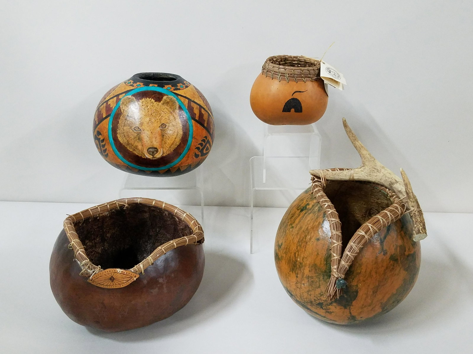 4 Decorated Gourd Pots: 4-3/4" to 12-1/2" high. Crack to back of antler pot.