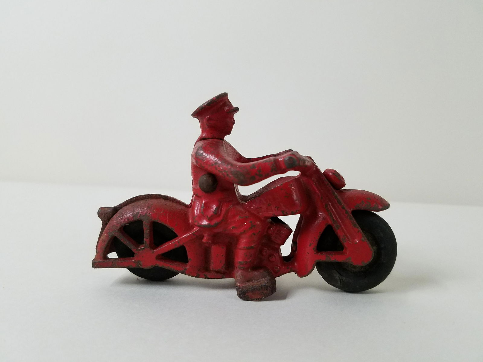 Cast Iron Motorcycle: Made in USA. 4-1/4" long x 2-3/4" high. Some paint losses.