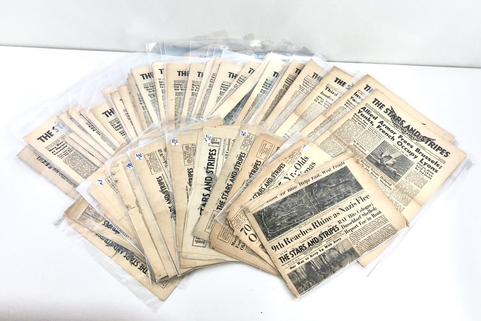53 "Stars and Stripes" Newspapers 1941-1945: Includes Italy edition, London edition, Paris edition, and more. Some with overtone.