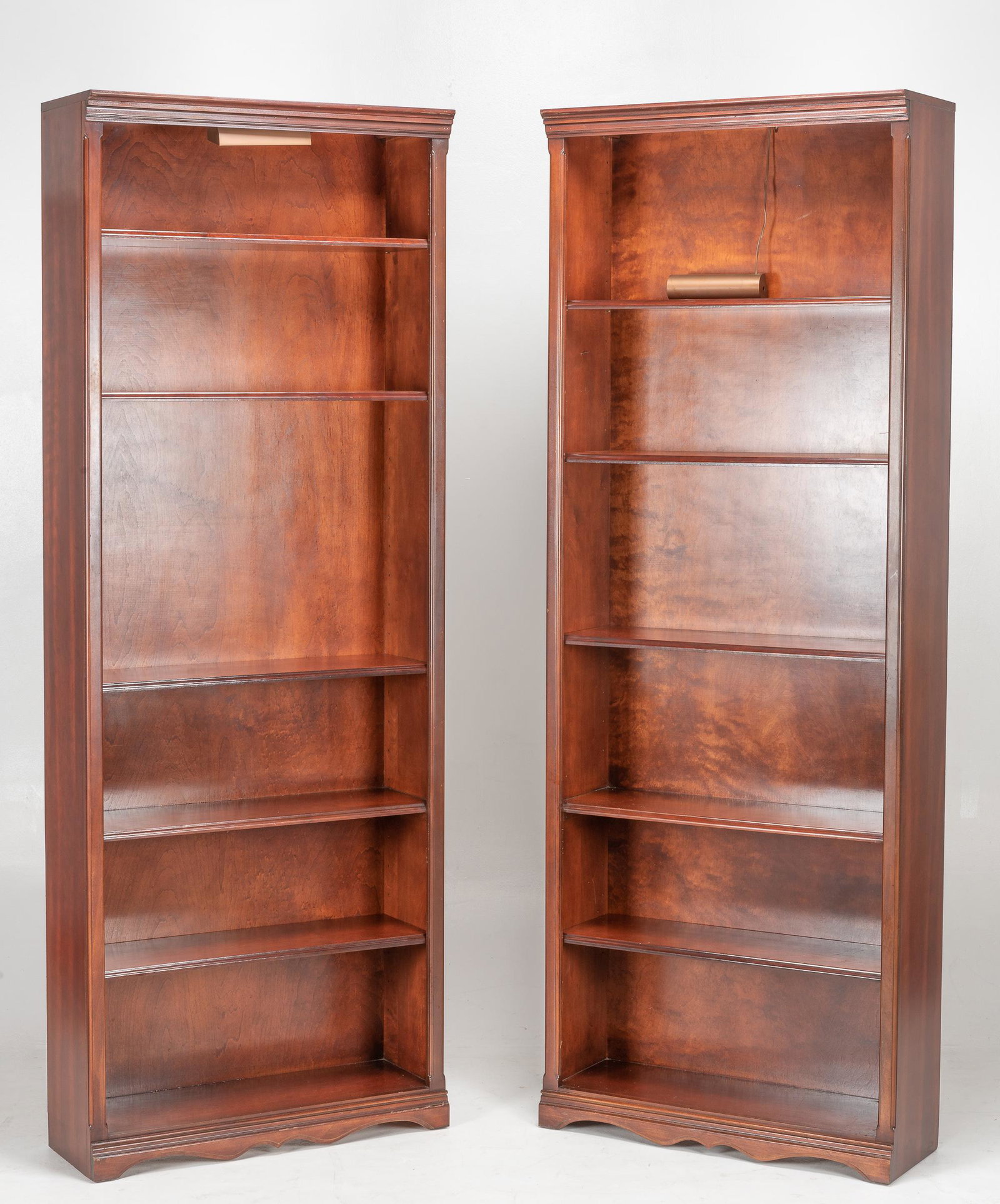 Pair of Cherry Bookcases: Each 31-1/2" wide x 10-3/4" deep x 84-1/4" high. Each has four shelves. Lamp unmounted on one. Some scratches and nicks to surface.