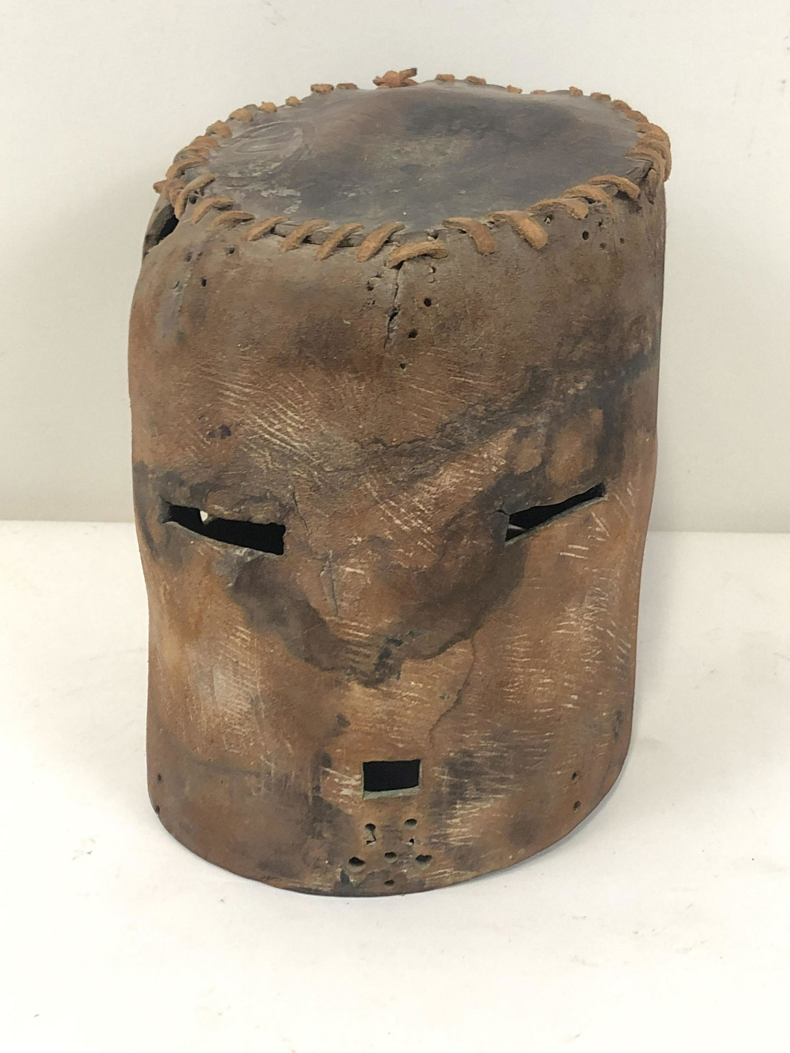 20th Century Leather Hopi Kachina Helmet: 6" wide x 9 1/2" deep x 7 3/4" high.
