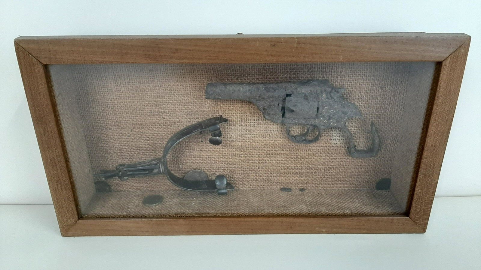 Antique .32 Cal. Revolver and Spur: Found in a wall of the Primm Bros. House in Carrizozo, NM. Overall with frame 15 1/2" wide X 8 1/4" high.
