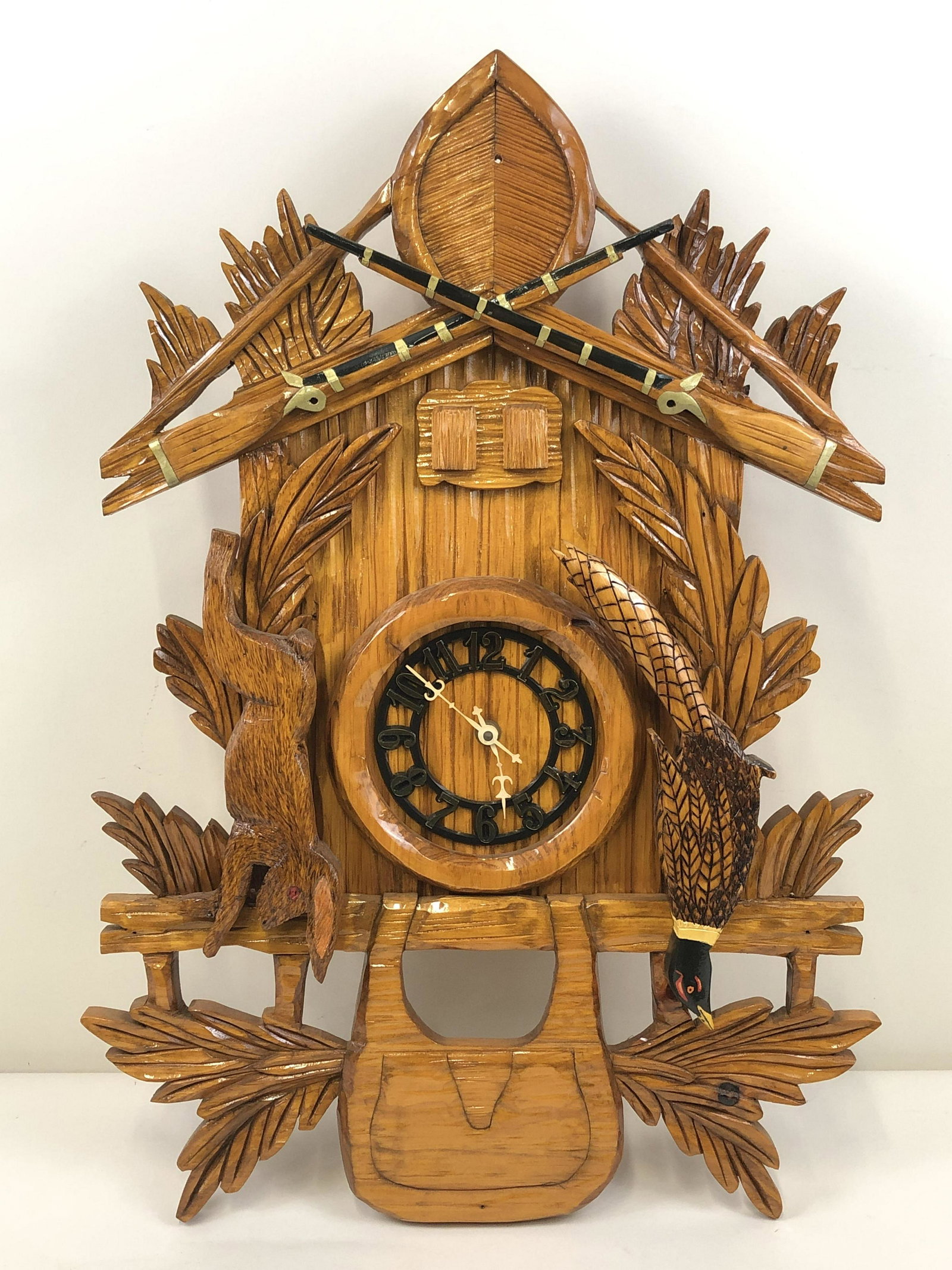 Carved Wall Clock: 18" wide x 5 1/4" deep x 27 1/2" high.