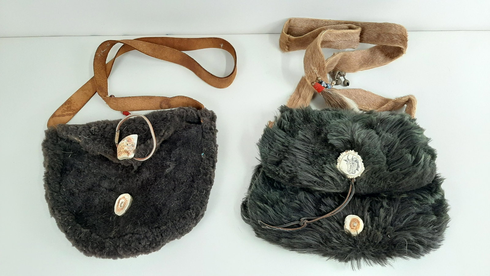 2 Buffalo and Goat Hide Bags: Each approx. 13" wide.