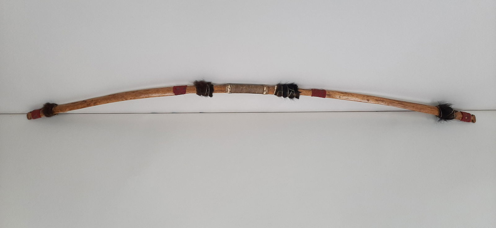 Plains Indian Buffalo Hunt Bow: Dated 1875. 63-3/4" long.