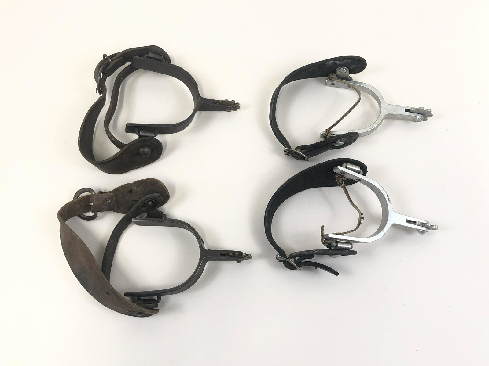 2 Pairs of Mid Century Spurs: Adjustable back straps.