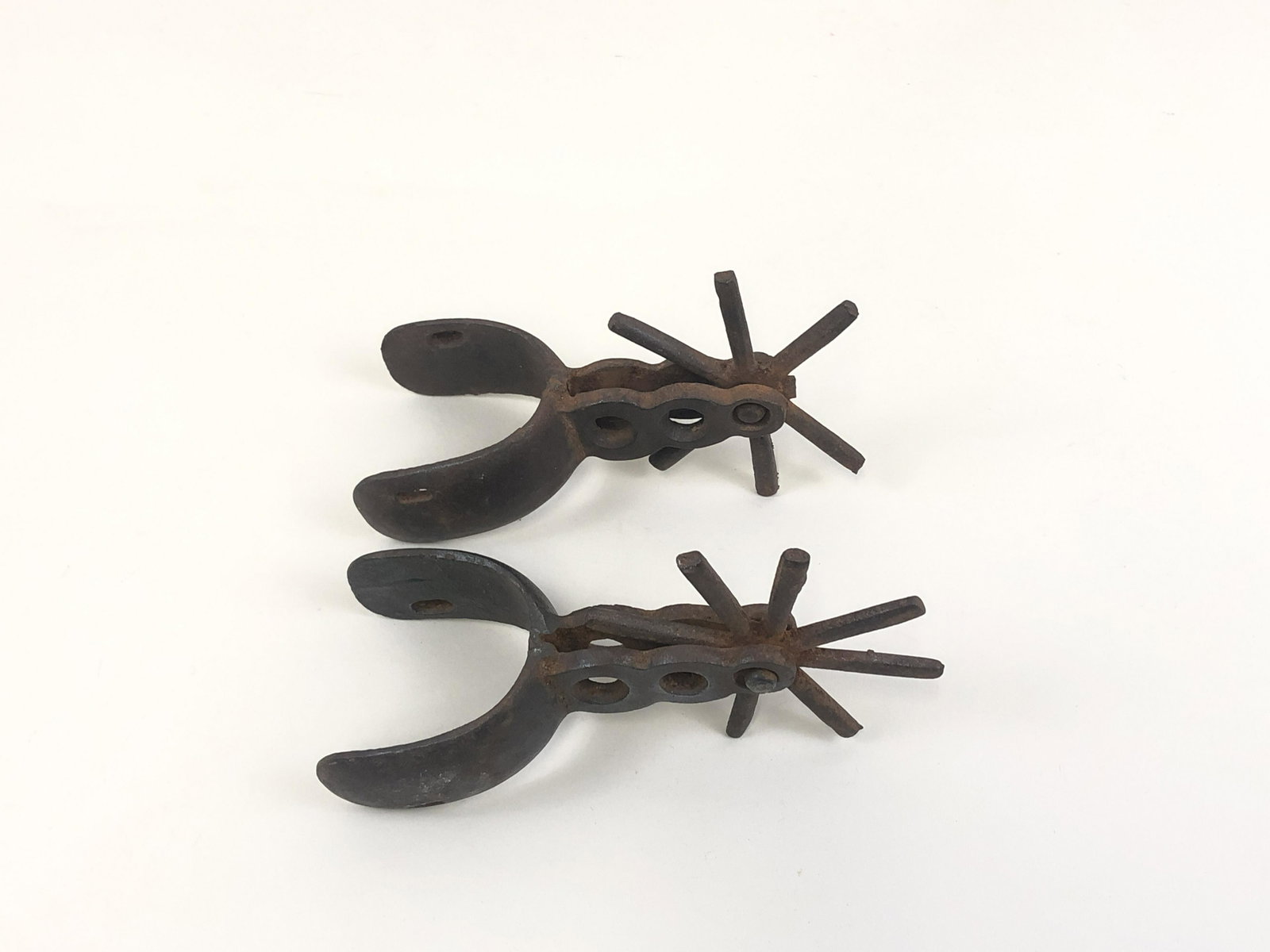 Pair of Spanish Colonial Spurs: Adjustable back straps.