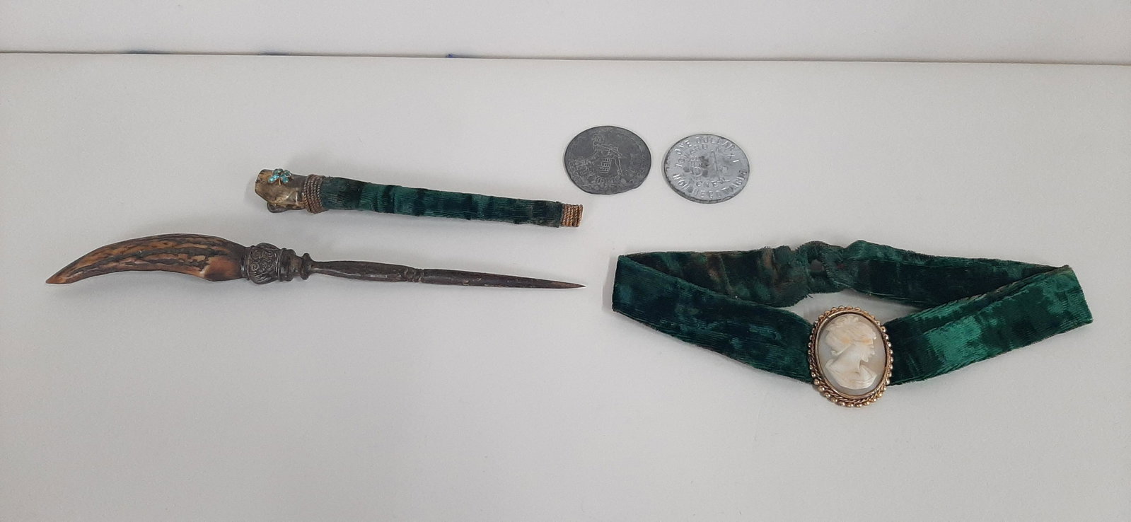 Group of Brothel Items: Includes 2 tokens, daggers, and choker with shell cameo. Tokens: 1 3/4" diameter. Dagger: 9 1/2" long.