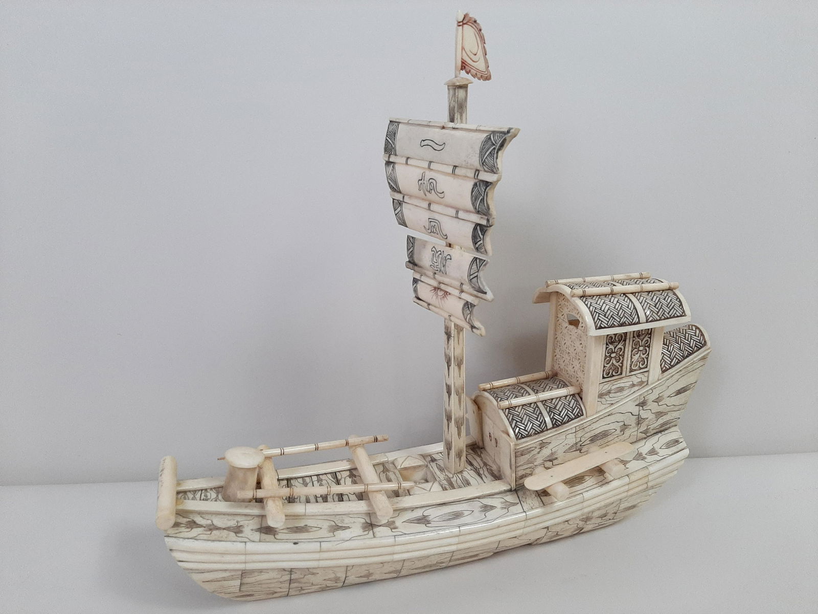 Bone Carved Ship: 18" long X 16" high. Repair to sails and flag.
