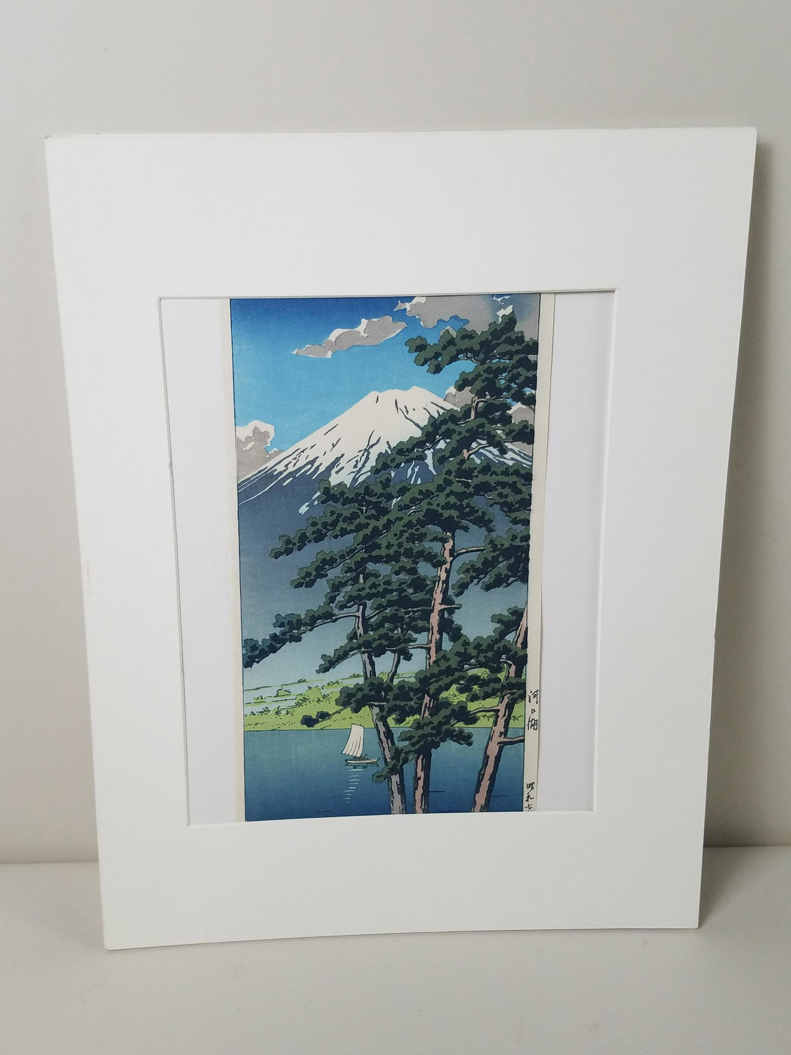 Hasui Kawase "Kawaguchi Lake" Woodblock Print: Hasui Kawase (1883-1957 Japan). Print is 14 1/2 " X 7". Hinged onto mat. Overall with mat board 18" high x 14" wide.