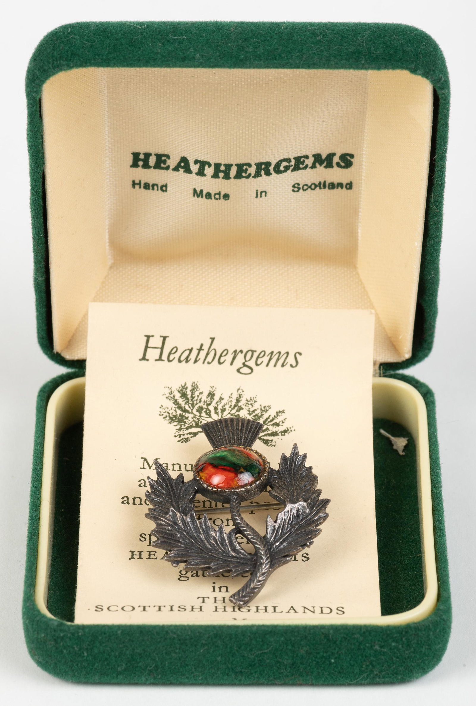 Heathergems Pin: Made in Scotland. 1-1/8" x 1-1/2". In original box. IMPORTANT: Before bidding, please read the terms and conditions below. When you registered for the auction you agreed to these terms and will be req