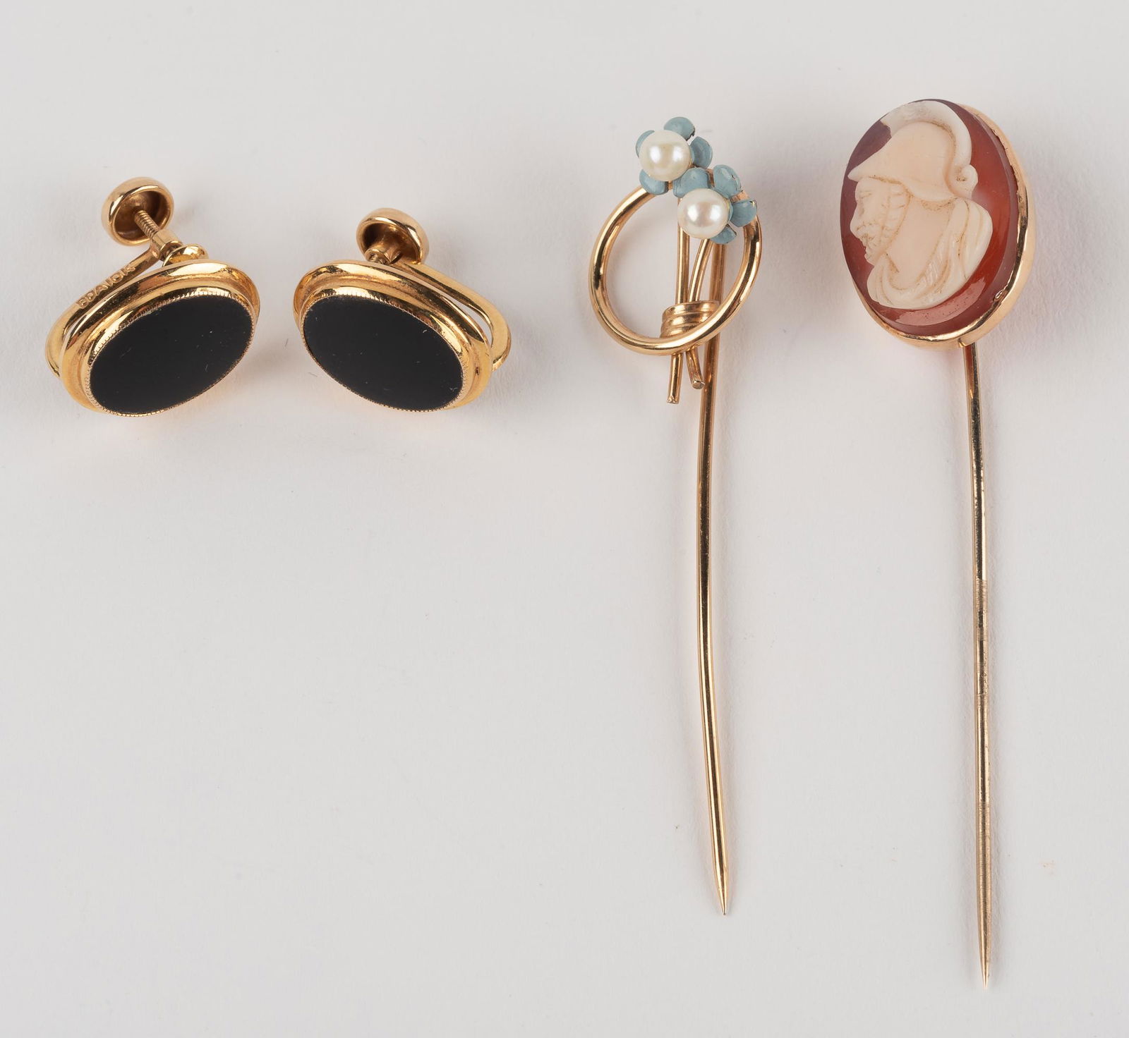 Gold Stick Pins & Earrings: Includes hardstone cameo stick pin, onyx screwback earrings. 4.7 dwt. IMPORTANT: Before bidding, please read the terms and conditions below. When you registered for the auction you agreed to these ter