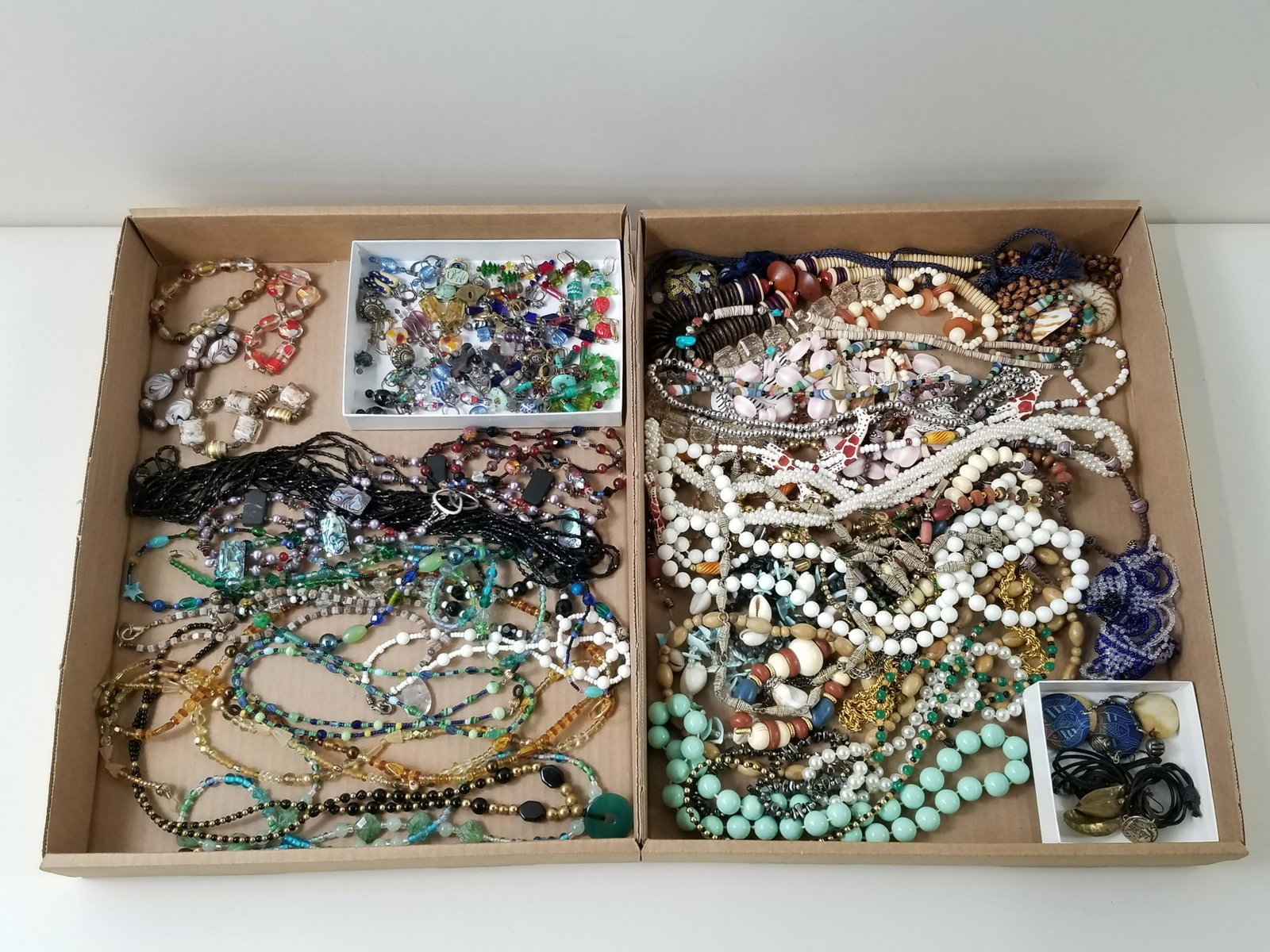 Grouping of Costume and Craft Jewelry: Includes beaded necklaces, bracelets and earrings. IMPORTANT: Before bidding, please read the terms and conditions below. When you registered for the auction you agreed to these terms and will be requ