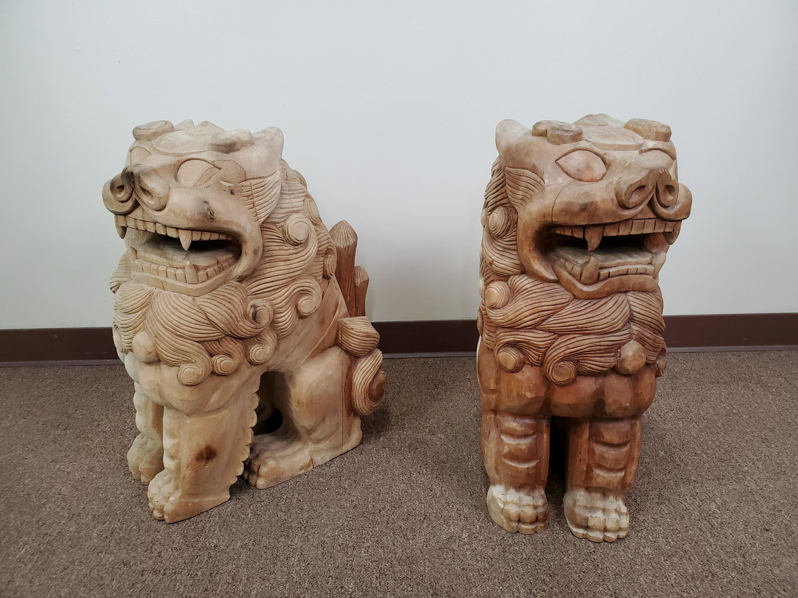 Pair of 24-1/2" Wood Carved Foo Dogs: Signed. 9 1/2" wide X 19" deep X 24 1/2" high. Some splits and discoloration.