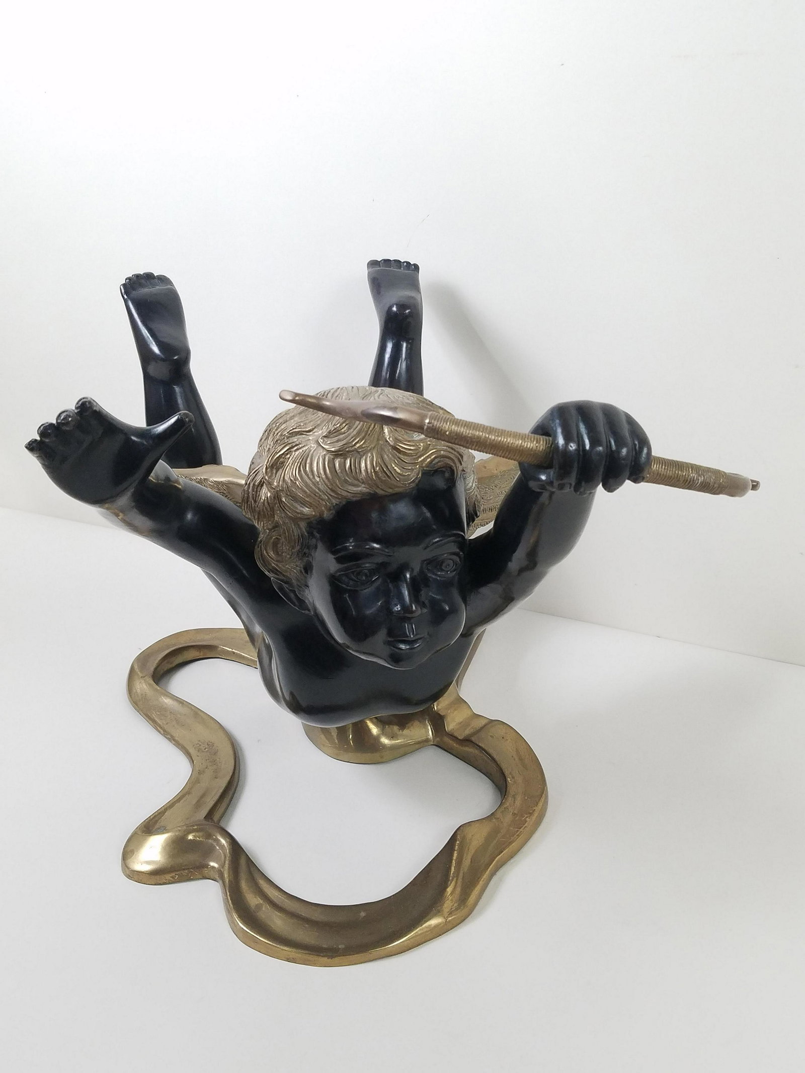Brass Cupid Table Base: Glass not included. 18" wide x 26" long x 16" high.