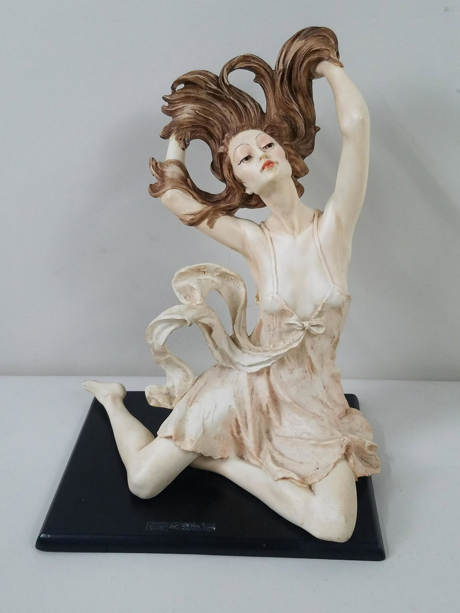 Santini Female Figurine: 9-1/2" wide x 12-1/4" high. Discoloration on base.