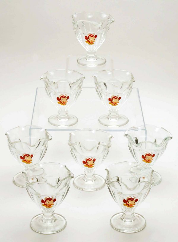 8 Borden's Ice Cream Dishes: DESCRIPTION: Lot of eight Borden's glass ice cream dishes. Decorated with enameled transfer decoration of Elsie the Cow. PROVENANCE: Property from the collection of Charles D. Morris, Mechanicsburg, P