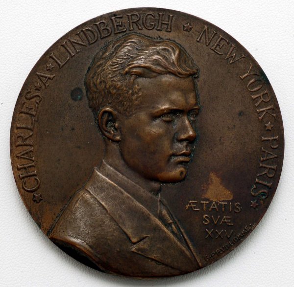 1927 Charles Lindbergh Commemorative Medallion: DESCRIPTION: A bronze medallion commemorating Charles Lindbergh. Obverse with bust of Lindbergh in relief by G. Prudhomme inscribed "Charles Lindbergh New York Paris Aetatis Svae XXV". Reverse with La