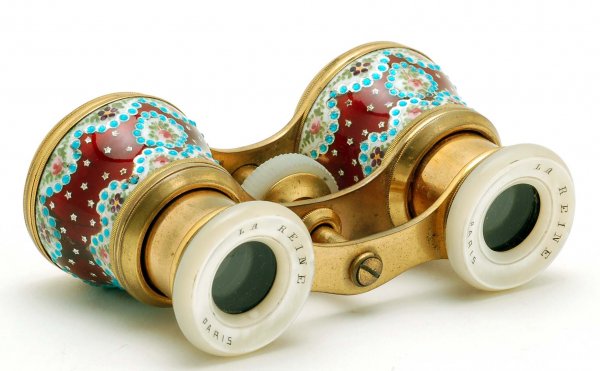 French La Reine Enameled Opera Glasses: DESCRIPTION: A pair of French opera glasses. Brass body decorated with ornate enameling of stars on a dark red ground with swags of panels of flowers. Mother of pearl eye guards marked "La Reine Paris