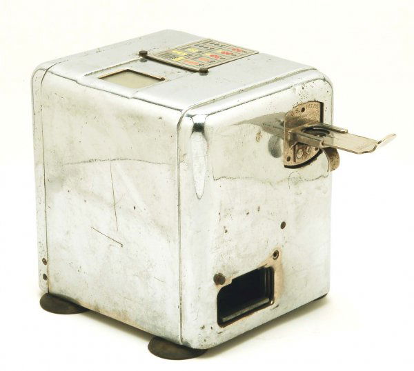 Coin Operated Mills Novelty X Plus Slot Machine: DESCRIPTION: Coin (nickel) operated Mills Novelty Co. X Plus slot machine game. Chrome plated case with plastic feet. "US Patent No. 1908380 May 9-1933 1908752 May 16-1933". Tag under base "Mills Nove